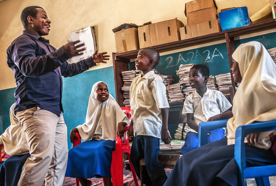 Classroom scene with teacher and attentive students.