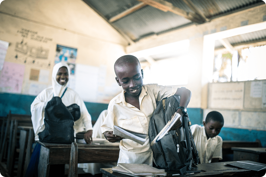 Students in classroom with backpacks
